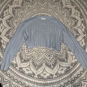 Cropped cable knit sweater